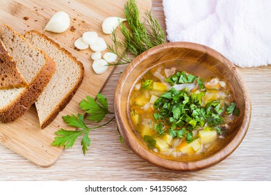 Homemade Soup, Rye Bread, Herbs And Garlic