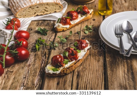 Similar – Image, Stock Photo Bruschetta with cream cheese, cherry tomatoes and basil