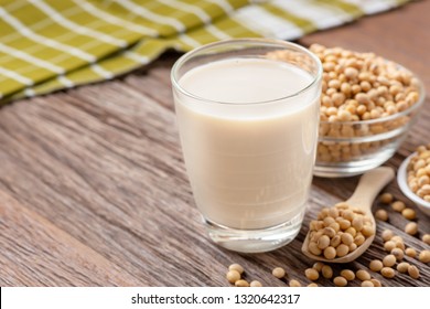 Homemade Soy milk and Soybean on wooden background, Healthy drink.