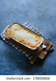 Homemade Spaghetti Brulee, With Pasta, Bolognese Sauce, Bechamel Sauce And Mozarella Cheese. Isolated On White. Copy Space.