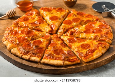 Homemade Spicy Hot Honey Pepperoni Pizza with Cheese and Sauce - Powered by Shutterstock