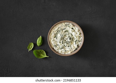 Homemade Spinach dip served in the bowl, top view