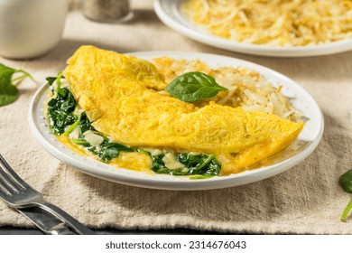 Homemade Spinach Florentine Omelet with Cheese and Potatoes