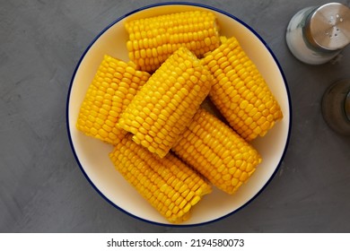 Homemade Steamed Corn On The Cob With Butter On A Plate, Top View. Flat Lay, Overhead, From Above.