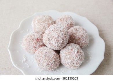 Homemade Strawberry, Date, Cashew And Coconut Bliss Ball On Vintage Plate