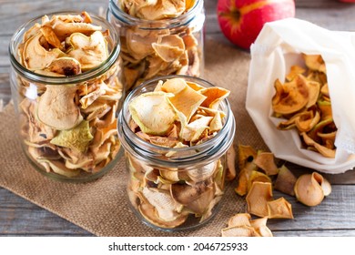 Homemade Sun-dried Organic Apple Slices, Crispy Apple Chips, On An Old Rustic Wooden Table With Fresh Apple. Healthy Eating. Vitamins.