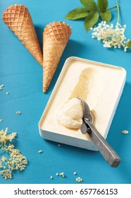 Homemade Sweet Elderflower Ice Cream In A Small Metal Mold With Waffle Cones And Rustic Scooper. Selective Focus.