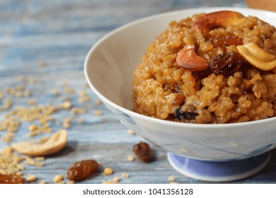 Homemade Sweet Pongal Topped With Raisins Nuts, Selective Focus