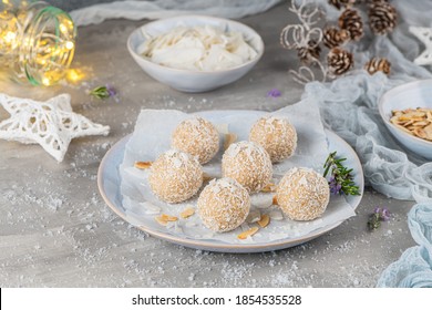 Homemade sweet white chocolate and coconut in a plate. Candy - snowball truffles on a Christmas table