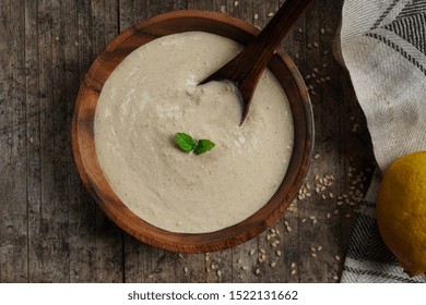 Homemade Tahini Sauce / Paste -Middle Eastern Dip In A Wooden Bowl, Top View