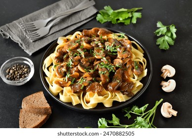  Homemade tasty beef stroganoff with mushrooms and pasta on plate - Powered by Shutterstock