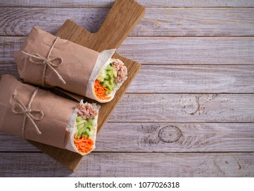 Homemade Tasty Burrito With Tuna Fish, Cucumber, Avocado And Carrot On Wooden Background. Tuna Wraps. Horizontal, Overhead