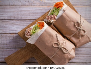 Homemade Tasty Burrito With Tuna Fish, Cucumber, Avocado And Carrot On Wooden Background. Tuna Wraps. Horizontal, Overhead