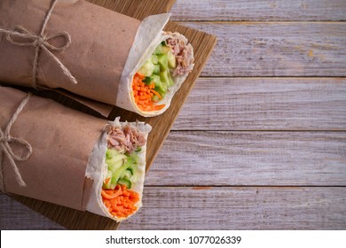 Homemade Tasty Burrito With Tuna Fish, Cucumber, Avocado And Carrot On Wooden Background. Tuna Wraps. Horizontal, Overhead