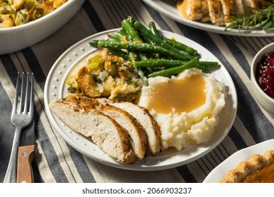 Homemade Thanksgiving Day Turkey Dinner Plate With Stuffing Gravy And Beans