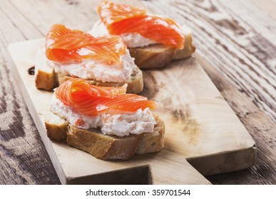 Homemade toasts with cream cheese dip. Best smoked salmon appetizers