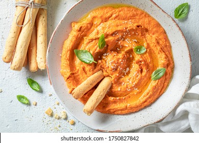 Homemade Tomato Hummus With Grissini, Basil And Sesame