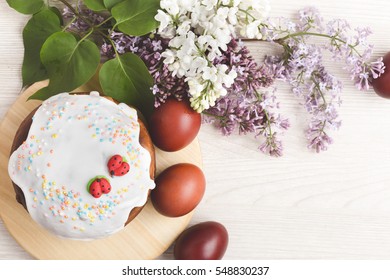 Homemade Traditional Easter Cake  With Sugar Icing, Decorated With Painted Eggs. Holiday Table Viewed From Above