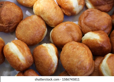 Homemade traditional hungarian dish named fank during food festival.  Freshly baked or deep fried stack of doughnuts. Fast food snack sweetness fried in oil - Shutterstock ID 1586745811
