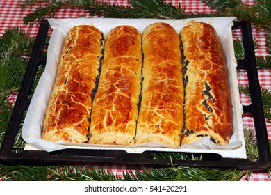 Homemade Traditional Poppy Seed And Walnut Rolls For Christmas Holiday. Tradition Hungarian Christmas Cake Name Is Beigli Or Bejgli. My Mother's Beautiful Christmas Cake With Her Own Hands
