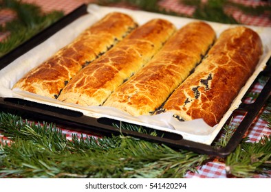 Homemade Traditional Poppy Seed And Walnut Rolls For Christmas Holiday. Tradition Hungarian Christmas Cake Name Is Beigli Or Bejgli. My Mother's Beautiful Christmas Cake With Her Own Hands
