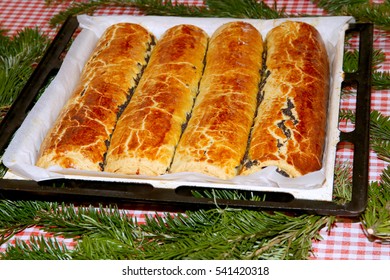 Homemade Traditional Poppy Seed And Walnut Rolls For Christmas Holiday. Tradition Hungarian Christmas Cake Name Is Beigli Or Bejgli. My Mother's Beautiful Christmas Cake With Her Own Hands
