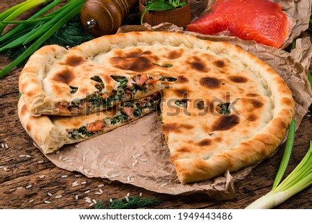 Homemade traditional tasty Ossetian pie with red fish, ossetian salmon pie Stock photo © 