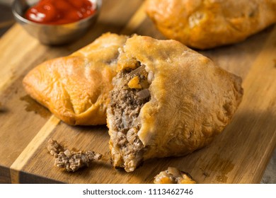 Homemade Upper MIchigan Pasty Meat Pie with Ketchup - Shutterstock ID 1113462746