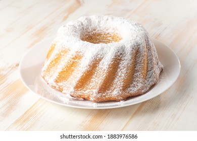 Homemade Vanilla Bundt Cake On White Wooden Background.