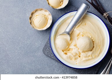 Homemade vanilla, caramel ice cream in vintage bowl Organic product on a grey stone background