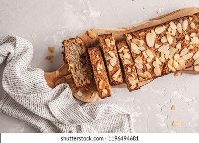 Homemade Vegan Banana Bread With Almonds And Chocolate, Gray Background. Clean Eating Concept.