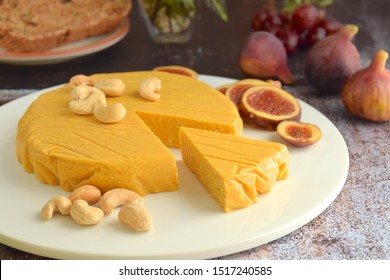Homemade vegan cheese made from cashew nuts served with fig fruit. Selective focus