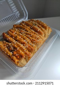 Homemade Vegan Garlic Bread In The  Aesthetic Packaging On The White Desk