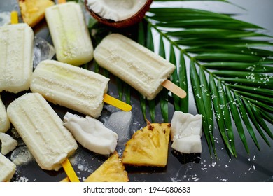 Homemade vegan popsicles made with coconut milk and pineapple. Delicious healthy summer snack - Powered by Shutterstock