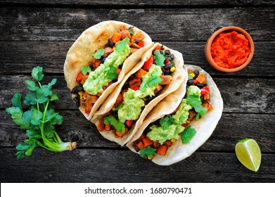 Homemade Vegan Tacos With Black Beans, Sweet Potato And Guacamole And Tortillas Flatbread. Clean Eating, Plant Based Food Concept. Top View