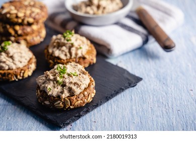 Homemade vegan tuna spread served on whole grain bread, with a coffee and orange juice on the side. - Powered by Shutterstock