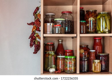 Homemade Vegetables In Jars On Wooden Shelves In The Home Pantry. Pickled Food, As Stocks From The Autumn Harvest, Will Be Useful For Self-isolation. Healthy Healthy Food From The Garden.