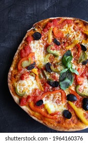 Homemade Vegetarian Pizza On Thin Crust With Bell Peppers, Cheese And Olives. Pizza With Imperfections