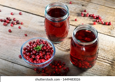 Homemade Vitamin Drink. Cranberry Juice And Fresh Cranberries On The Table
