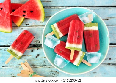 Homemade watermelon popsicles on a plate. Top view on a rustic blue wood background. Summer food concept. - Powered by Shutterstock