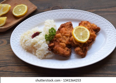 Homemade  Weiner Schnitzel on white plate , wooden background.  - Shutterstock ID 1341364253