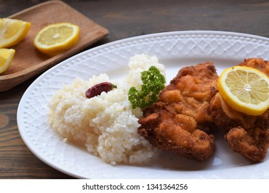 Homemade  Weiner Schnitzel on white plate , wooden background.  - Shutterstock ID 1341364256