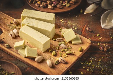 Homemade White Chocolate Fudge With Pistachio Ready To Eat On Wooden Cutting Board