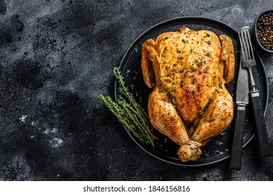 Homemade whole baked chicken rotisserie with thyme. Black background. Top view. Copy space - Shutterstock ID 1846156816