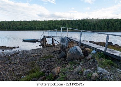 Homemade Wooden Pier For Mooring Boats At Low Tide And High Tide On The White Sea