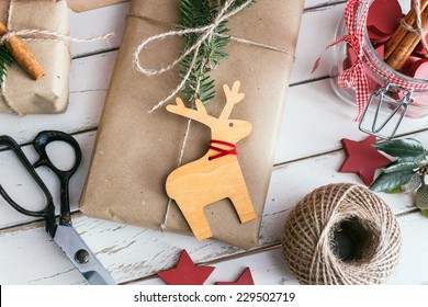 Homemade wrapped christmas presents with tools and decorations - Powered by Shutterstock