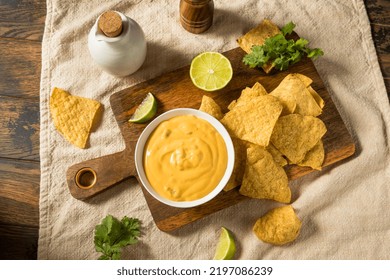 Homemade Yellow Queso Cheese Dip With Tortilla Chips And Lime