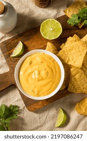 Homemade Yellow Queso Cheese Dip With Tortilla Chips And Lime