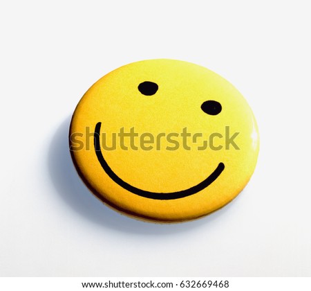 Homemade yellow smiley against white background