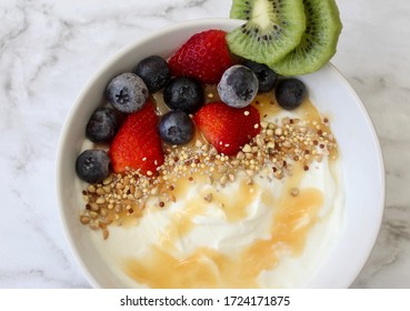 Homemade Yogurt Bowl With Honey Drizzle And Berries